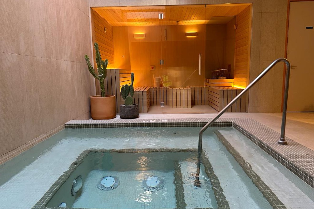 Mii Amo Spa hot pool with sauna behind glass